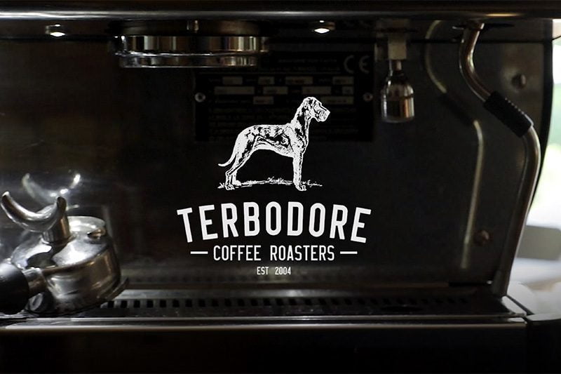 Terbodore Coffee Roasters logo on a milk steam machine - Terbodore